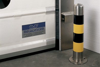 Stainless steel, 600 mm high bollard or post to protect doors from impacts.